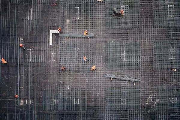 Pressed and welded grating